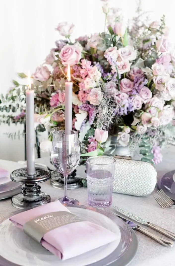 Romantic lavender rose centerpiece with taper candles and lilac glassware editorial tablescape - lavender photoshoot
