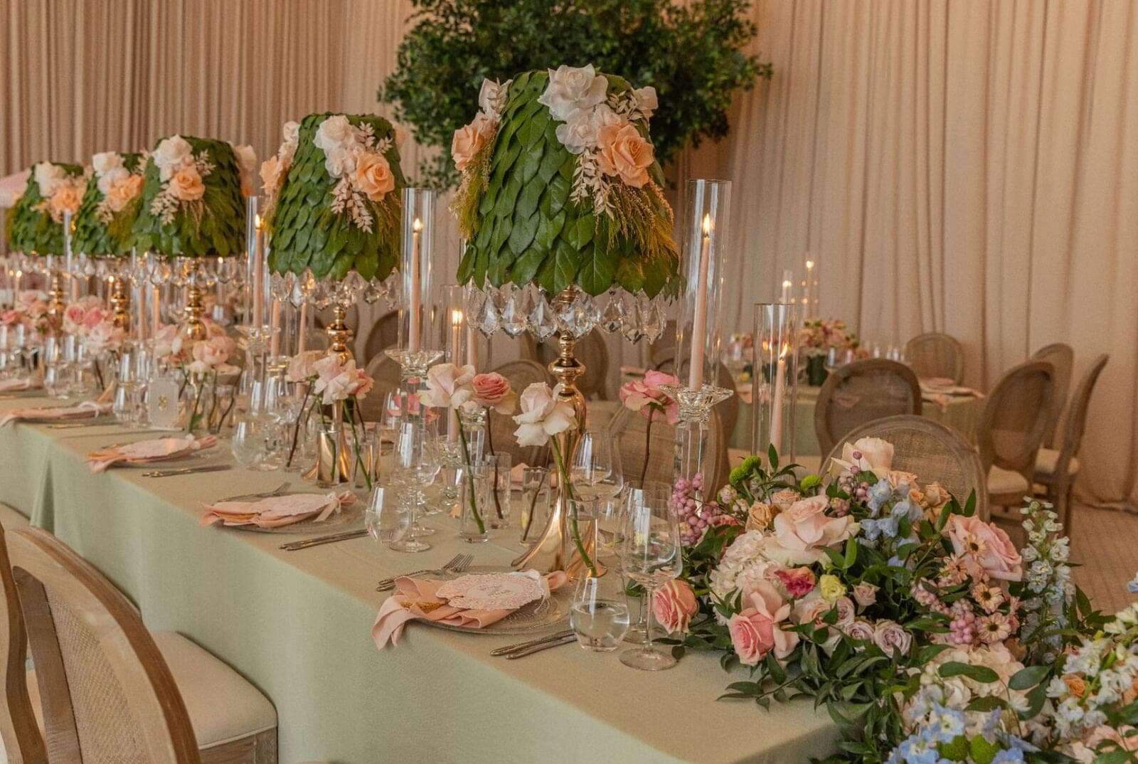 Leaf Lampshade Centerpieces - Sculptural leaf-and-rose lampshades with crystal candelabras along a sage tablescape by Aura Design Flowers Miami