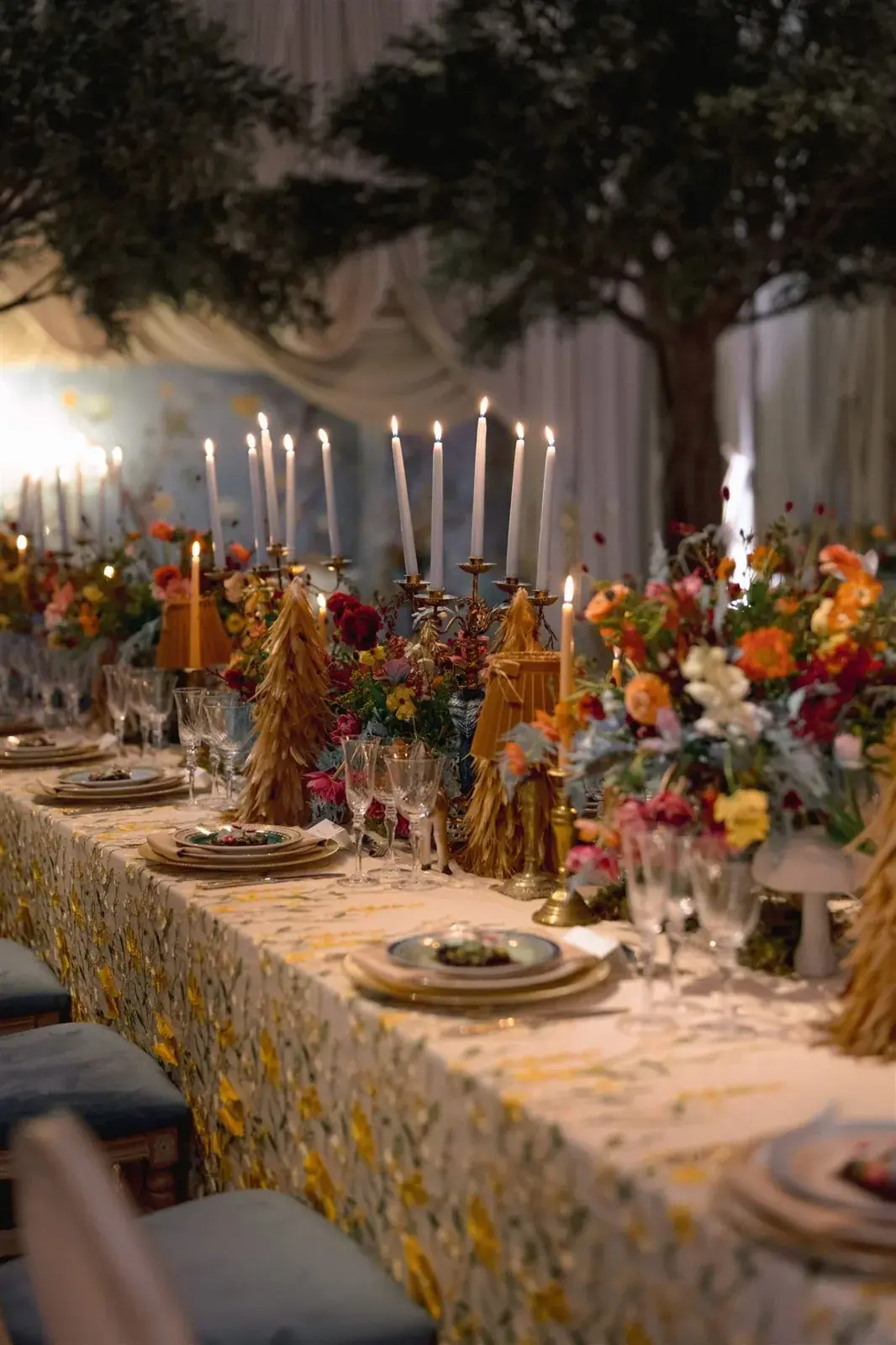 Editorial baby shower tablescape with lush florals and candlelight in Miami