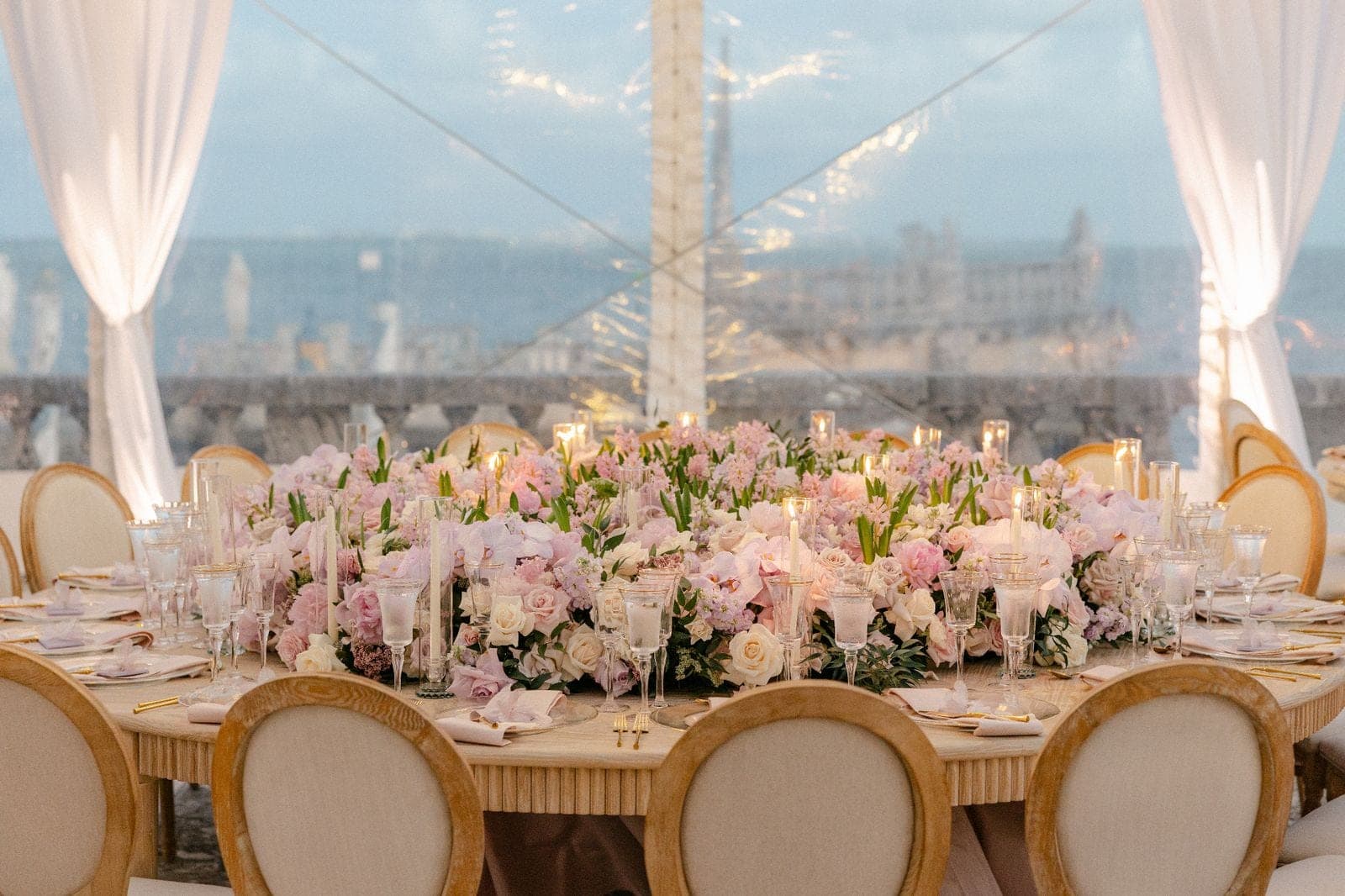 Dramatic red rose sweetheart installation with draped ceiling and gold mirrored dance floor