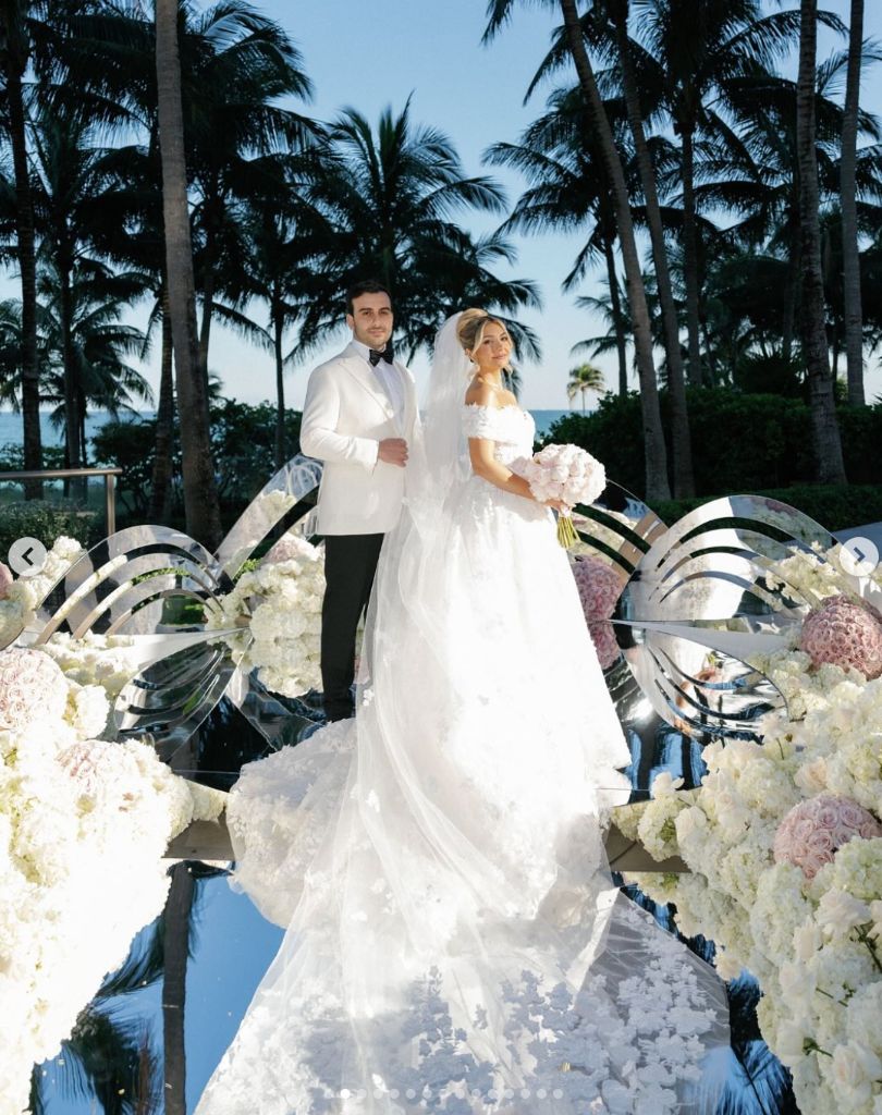 Tropical Elegance - Beachside ceremony with mirrored aisle & white florals by Aura Floral Design Miami