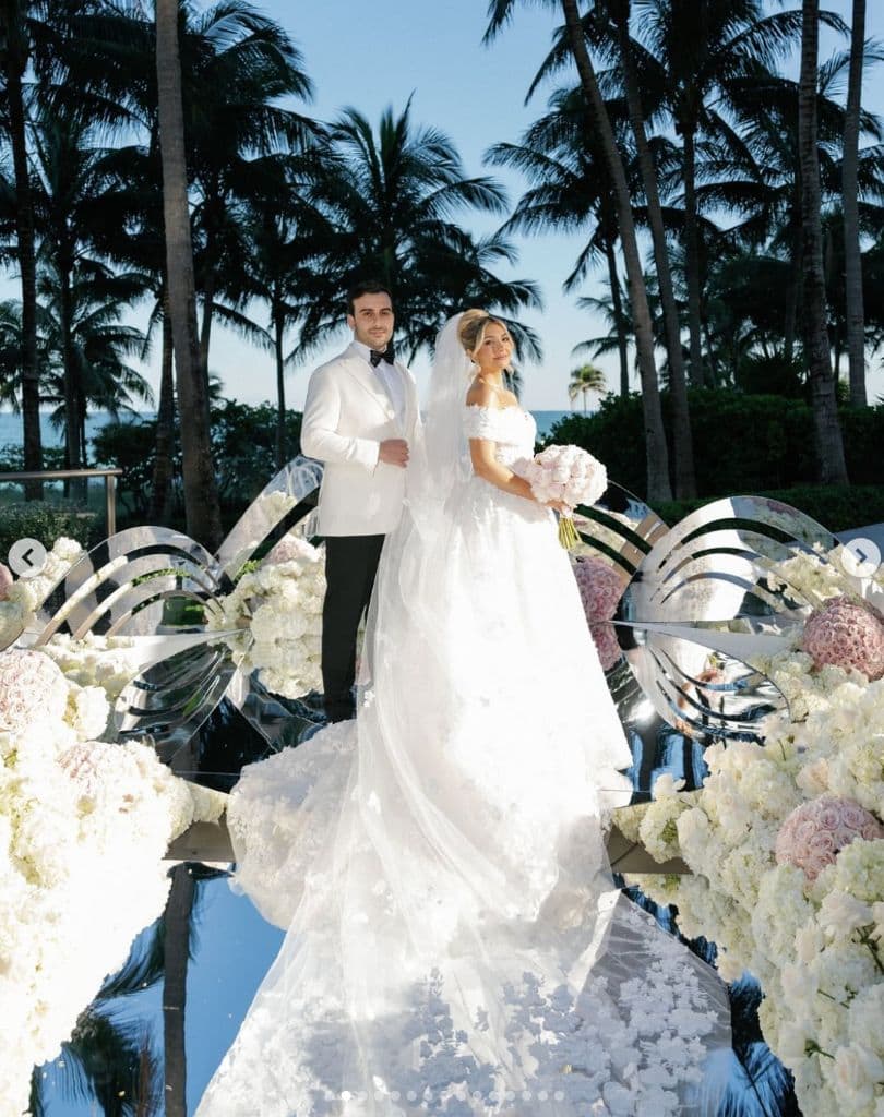 Tropical Elegance - Beachside ceremony with mirrored aisle & white florals by Aura Design Flowers Miami