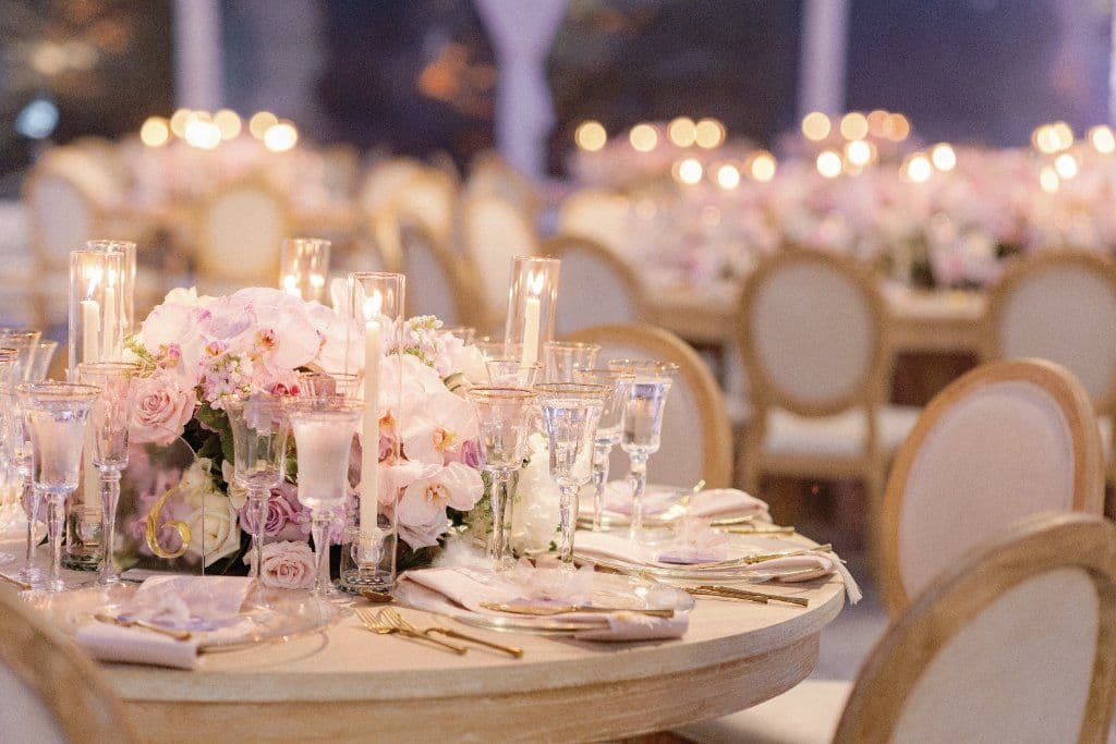 Romantic candlelit reception with cascading floral centerpieces at Vizcaya