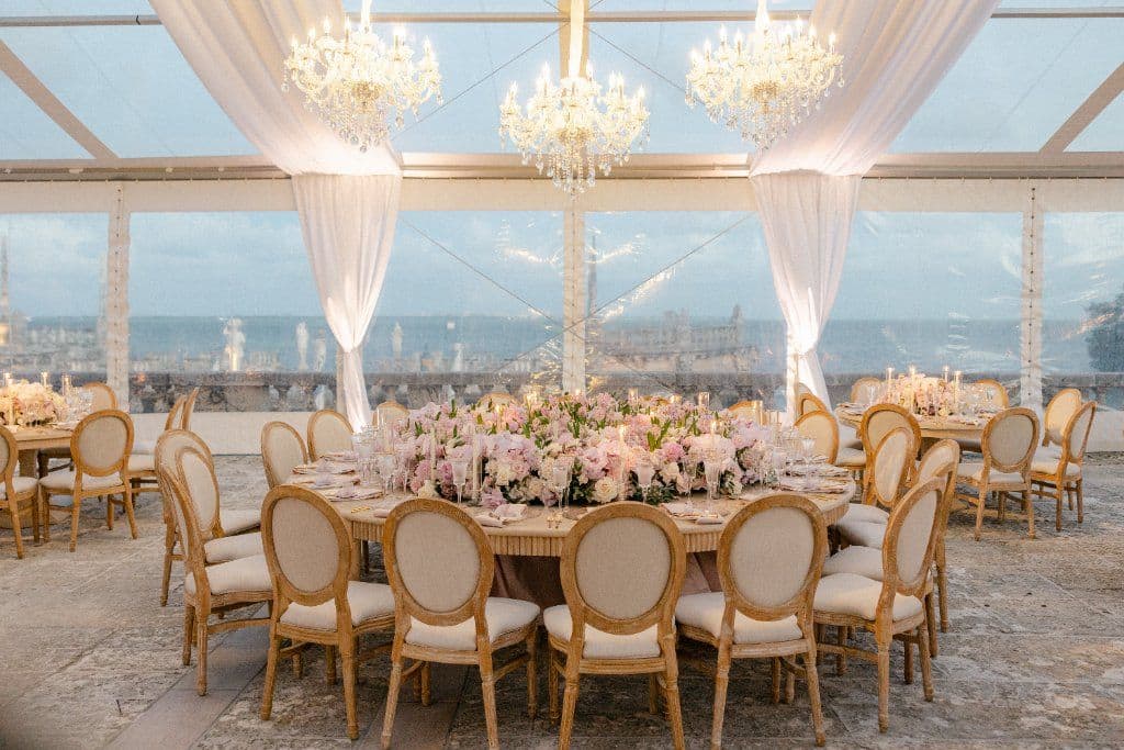 Crystal Pavilion - Glass tent with chandeliers and lush centerpieces by Aura Design Flowers Miami