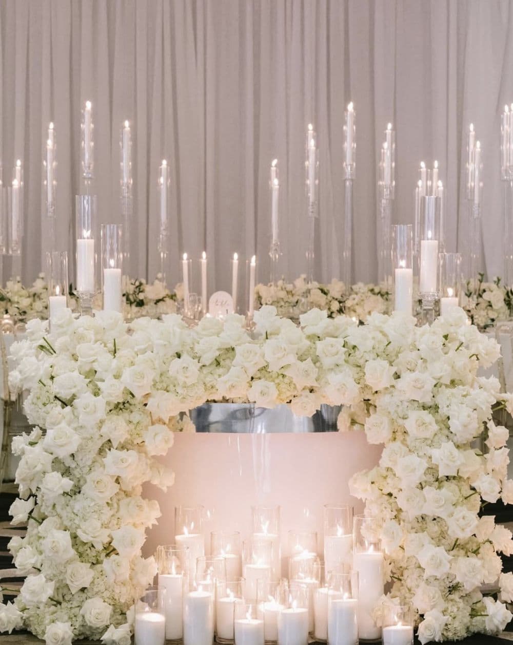 Luxury white rose sweetheart table with candlelight at Miami wedding