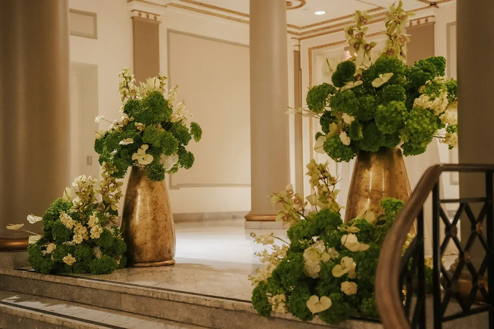 Sculptural asymmetric floral arch with architectural line and deliberate negative space