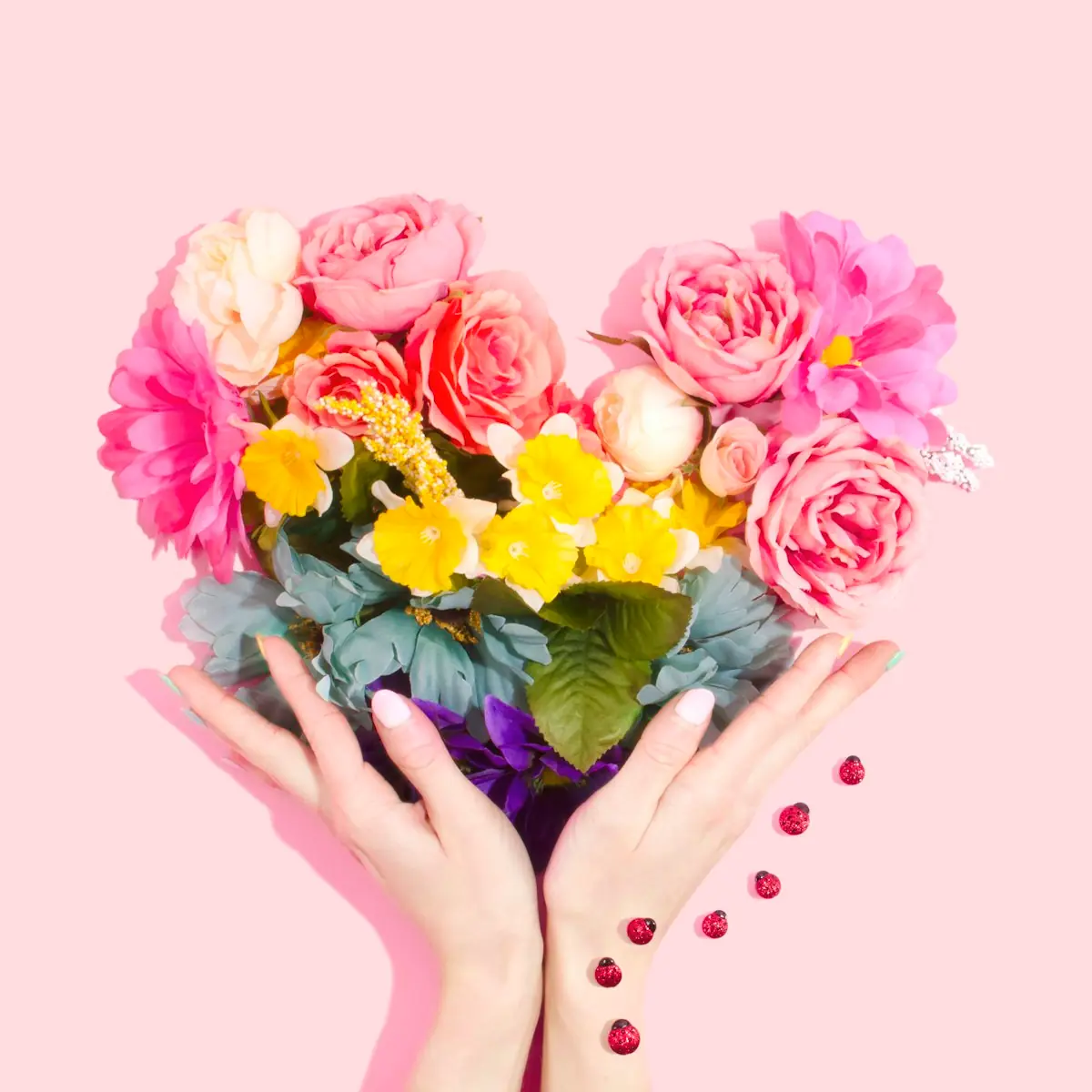 Spring peonies and garden roses in a romantic pink arrangement for South Florida wedding